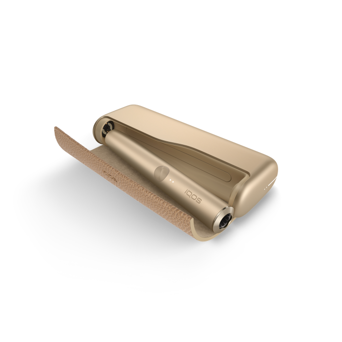 IQOS ILUMA PRIME Your first steps with IQOS ILUMA PRIME Follow this guide to learn all about your new IQOS ILUMA PRIME: How to use, maintain and charge your device to make the most of your experience. Get started with your new IQOS ILUMA PRIME with a few easy steps 1.Before first use, fully charge your device with AC Power Adapter* (sold separately) and Charging Cable for approximately 135 minutes. Tap the button on your IQOS ILUMA PRIME Pocket Charger to check your battery level. If the level is low then charge the pocket charger with a compatible AC power adapter* (sold separately) and cable. 2.By pressing the button at the top of your Pocket Charger for four seconds you can turn the device ON/OFF. Then check the status lights on your IQOS ILUMA PRIME Holder to see how many experiences you have. Two lights mean it’s fully charged (ready for two uses). One light means it’s ready for one use. No lights mean the Holder needs to be charged in the Pocket Charger. 3.Gently insert a SMARTCORE stick as seen in the video. The Autostart is activated upon insertion of the SMARTCORE stick. If the Autostart is disabled, you can press the button on the Holder to start the experience. One vibration and lights pulsing slowly means it’s heating up the SMARTCORE stick. Two vibrations and light(s) ON means it is ready for use. 4.When you feel another two vibrations, your IQOS time is nearly up (30 sec or 2 puffs remaining). Simply remove the SMARTCORE stick and remember to use a new stick for your next experience. Remember that one light means you only have one experience left, so you'll need to charge the Holder in the Pocket Charger after your next experience. 5.When your Holder is in the Pocket Charger there are two round lights that indicate the status of the Holder. When the round lights are pulsing white, this means the Holder is getting charged. One or two solid round lights on the Pocket Charger indicates how many experiences you have readily available. *Disclaimer: The AC Power Adapter is not included. Do use the IQOS Power Adapter from your previous IQOS device or purchase it separately at iqos.com or IQOS stores. See FAQ for more information. Get ready to experience next level tobacco with IQOS ILUMA PRIME, our most refined and advanced device yet. With SMARTCORE INDUCTION SYSTEM™ technology at its core, it delivers a clean and effortless experience. Because it heats from the inside out - IQOS ILUMA PRIME makes the perfect choice.