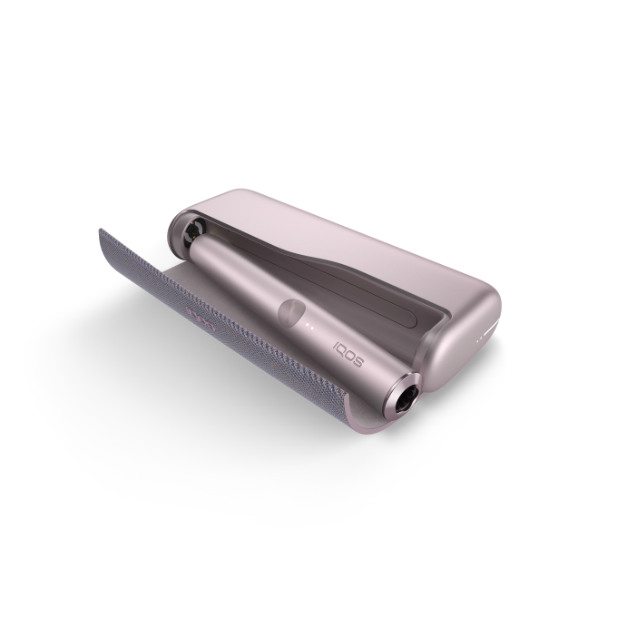 IQOS ILUMA PRIME Your first steps with IQOS ILUMA PRIME Follow this guide to learn all about your new IQOS ILUMA PRIME: How to use, maintain and charge your device to make the most of your experience. Get started with your new IQOS ILUMA PRIME with a few easy steps 1.Before first use, fully charge your device with AC Power Adapter* (sold separately) and Charging Cable for approximately 135 minutes. Tap the button on your IQOS ILUMA PRIME Pocket Charger to check your battery level. If the level is low then charge the pocket charger with a compatible AC power adapter* (sold separately) and cable. 2.By pressing the button at the top of your Pocket Charger for four seconds you can turn the device ON/OFF. Then check the status lights on your IQOS ILUMA PRIME Holder to see how many experiences you have. Two lights mean it’s fully charged (ready for two uses). One light means it’s ready for one use. No lights mean the Holder needs to be charged in the Pocket Charger. 3.Gently insert a SMARTCORE stick as seen in the video. The Autostart is activated upon insertion of the SMARTCORE stick. If the Autostart is disabled, you can press the button on the Holder to start the experience. One vibration and lights pulsing slowly means it’s heating up the SMARTCORE stick. Two vibrations and light(s) ON means it is ready for use. 4.When you feel another two vibrations, your IQOS time is nearly up (30 sec or 2 puffs remaining). Simply remove the SMARTCORE stick and remember to use a new stick for your next experience. Remember that one light means you only have one experience left, so you'll need to charge the Holder in the Pocket Charger after your next experience. 5.When your Holder is in the Pocket Charger there are two round lights that indicate the status of the Holder. When the round lights are pulsing white, this means the Holder is getting charged. One or two solid round lights on the Pocket Charger indicates how many experiences you have readily available. *Disclaimer: The AC Power Adapter is not included. Do use the IQOS Power Adapter from your previous IQOS device or purchase it separately at iqos.com or IQOS stores. See FAQ for more information. Get ready to experience next level tobacco with IQOS ILUMA PRIME, our most refined and advanced device yet. With SMARTCORE INDUCTION SYSTEM™ technology at its core, it delivers a clean and effortless experience. Because it heats from the inside out - IQOS ILUMA PRIME makes the perfect choice.